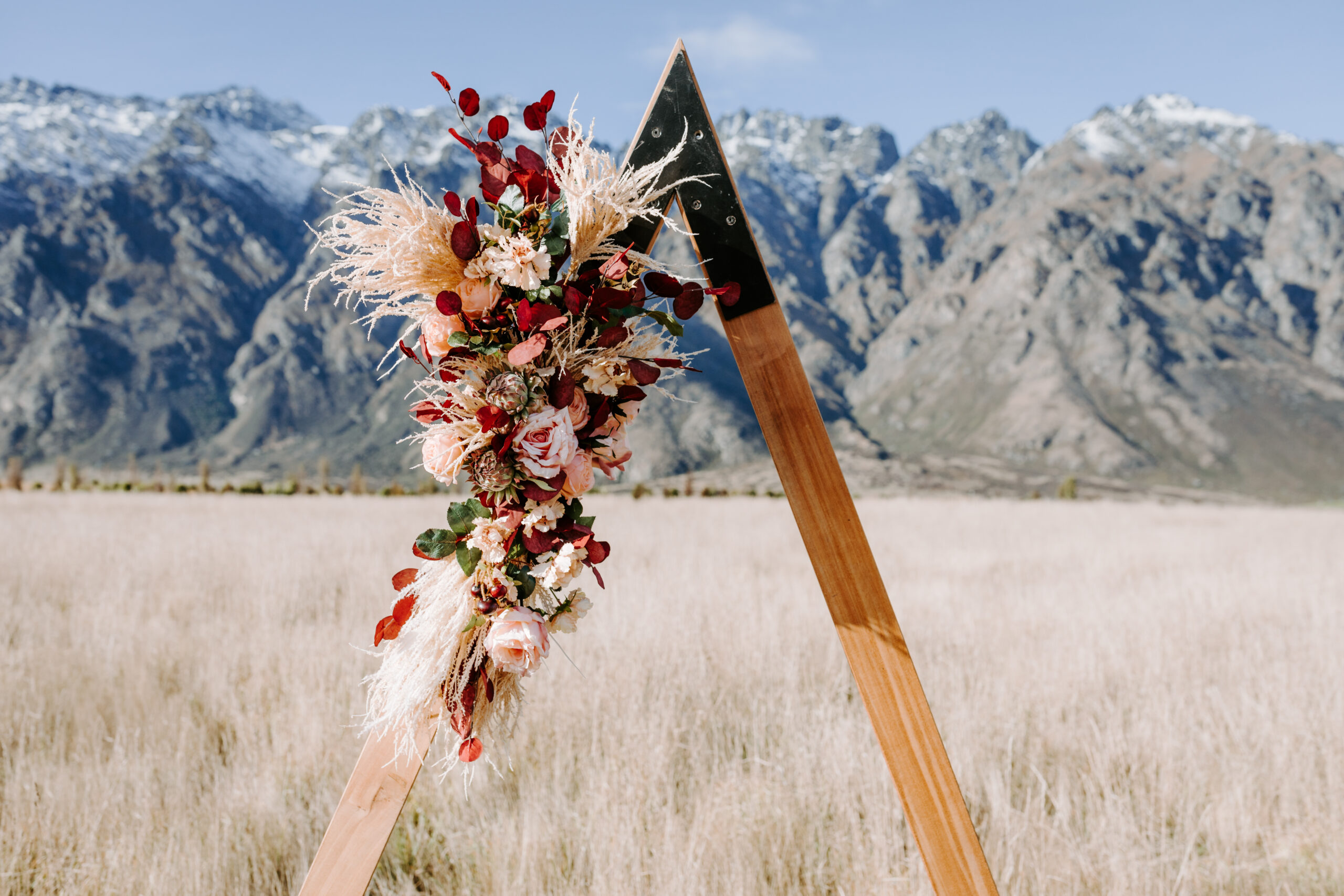 Wedding arch in feild with Main Backdrop, Elopement packages Queenstown