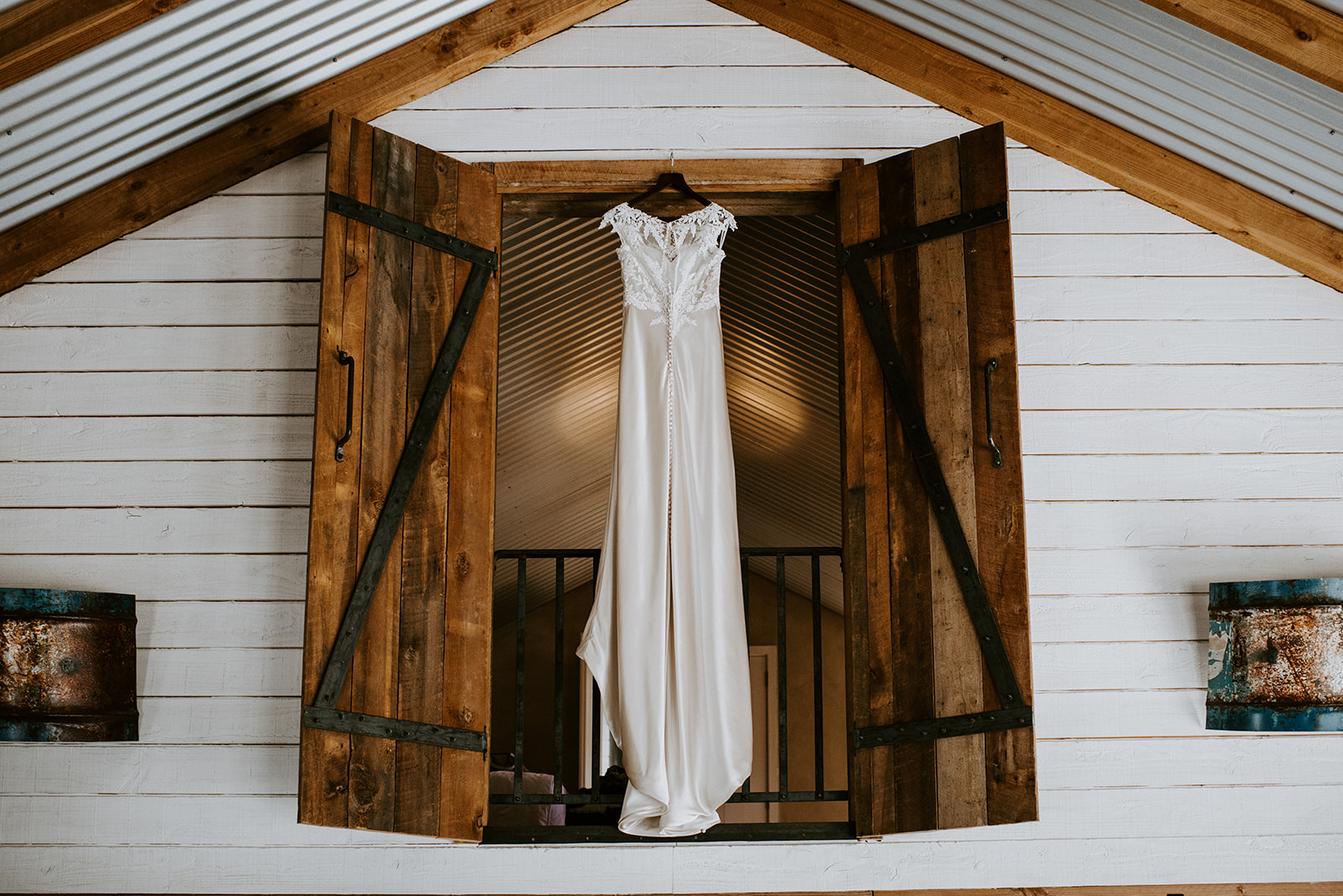 Elopement Packages Queenstown- Wedding dress hanging in the window 
